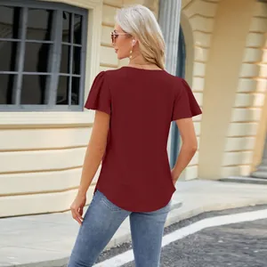 Back view of a burgundy hollow jacquard t-shirt with flutter sleeves and swallowtail hem.