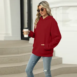 Casual red oversized hooded sweatshirt with a spacious front pocket and ribbed cuffs