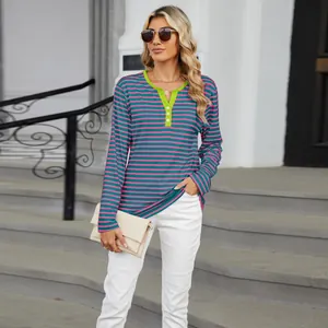 Detailed view of women's V-neck striped long sleeve t-shirt with contrast lime green collar.