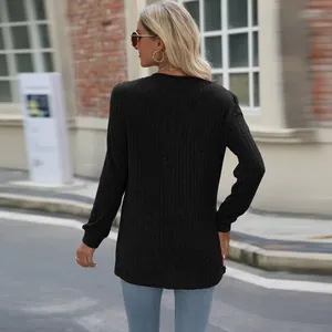 Back view of a black ribbed knit long sleeve top with casual puff sleeves for women