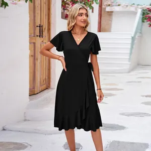 Elegant black V-neck wrap dress with ruffle sleeves and irregular hem detail