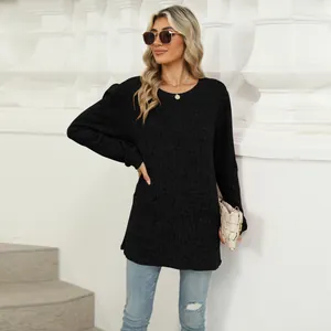 Elegant casual black crewneck long sleeve top featuring puff sleeves and front pockets