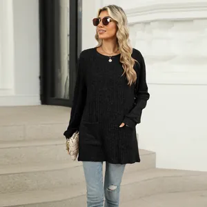 Detail view of black ribbed long sleeve tunic with functional pockets on a model