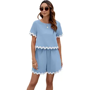 Blue two-piece summer set featuring scalloped white trim and round neck short sleeves
