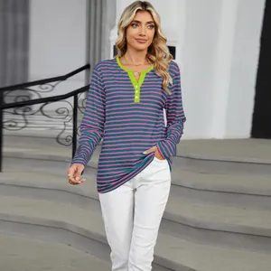 Detail showing women's long sleeve t-shirt with green contrast V-neck and pink stripes