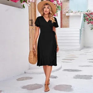 Elegant black cross V-neck short sleeve wrap dress with irregular ruffle hem detail