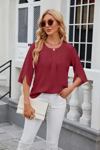 Elegant wine red chiffon blouse with slit half sleeves worn by a model outdoors