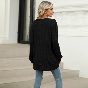 Back view of a black ribbed long sleeve top featuring bubble sleeves and a loose, casual fit