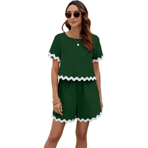 Women's two-piece set featuring scalloped trim, dark green short sleeve T-shirt and shorts