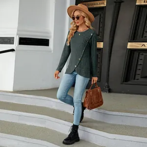 Close-up view of women's dark green ribbed long sleeve knit top with unique tulip hem