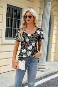 Detailed view of floral print summer t-shirt with square neck and petal sleeves on a model.