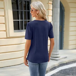Navy blue women's U-neck T-shirt with pleated puff sleeves detail shown in outdoor setting