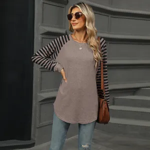 Close-up detail of the contrast stripe patchwork on the sleeves of this casual long sleeve T-shirt