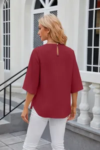 Back view of elegant maroon chiffon blouse featuring half sleeves and keyhole design
