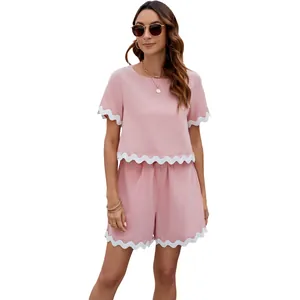 Summer pink two-piece set featuring white scalloped trim t-shirt and shorts for women