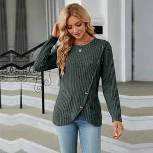 Detail view of women's ribbed knit long sleeve top featuring tulip hem and button accents