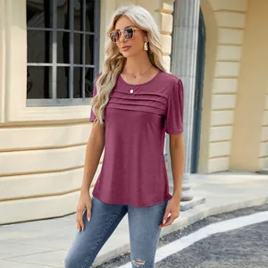 Model wearing a stylish plum pleated short-sleeve T-shirt in an outdoor urban setting