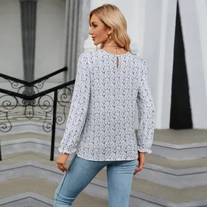 Back view of a long-sleeve floral print top with keyhole neck detail