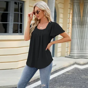 Outdoor full-shot of women's black square neck pleated hollow-out short sleeve t-shirt.