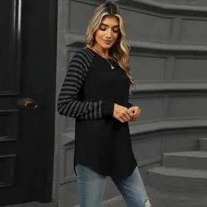 Detailed view of a women's stylish color block striped patchwork long sleeve top