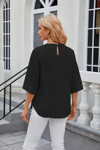 Back view of a black loose round neck chiffon blouse featuring a keyhole button closure
