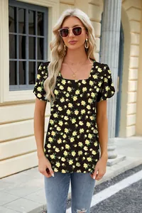 Detail view of a black floral print T-shirt with square neck and petal sleeves