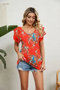 Detail view showing the red floral print and double layered ruffle sleeves on a V-neck top