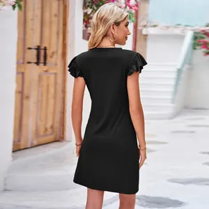 Back view of a chic black summer dress featuring elegant flutter ruffle sleeves.