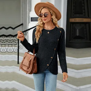Fashionable long-sleeve black top with tulip hem and decorative buttons on model
