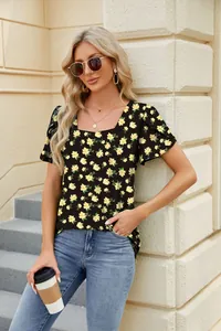 Detailed view of women's black floral t-shirt with square neck and unique petal sleeves