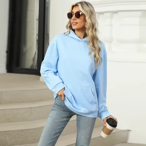 Stylish light blue women's oversized hoodie with front pocket for casual autumn wear