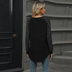 Back view of women's long-sleeve tee featuring striped sleeves and curved swallowtail hem