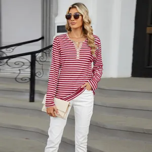 Casual red and white striped V-neck long sleeve T-shirt for women in outdoor setting.
