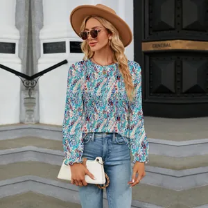 Close-up of casual floral print blouse with crew neck and long sleeves for women.