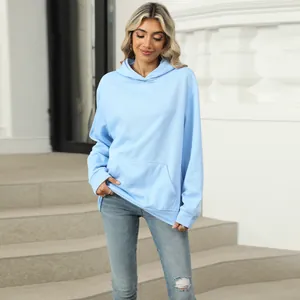 Comfortable light blue oversized hooded sweatshirt with kangaroo pocket shown on model