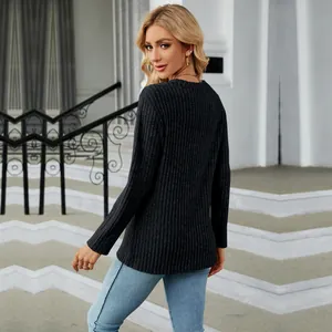 Back view of women's black long sleeve ribbed T-shirt showing the curved tulip hem detail