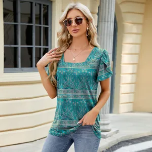 Detail view of the square neck and petal sleeve design on a teal paisley print t-shirt.