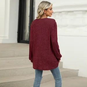 Back view of a casual burgundy ribbed long sleeve loose top with bubble sleeves.