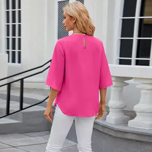 Back view of magenta loose chiffon blouse with half sleeves and round neck design