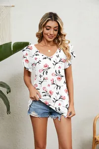 Close-up of women's summer white floral V-neck top with ruffled sleeves and rose print