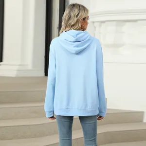 Back view of a minimalist light blue solid color hooded sweatshirt for women.