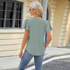 Back view of a sage green short sleeve t-shirt with delicate eyelet hollow out patterns