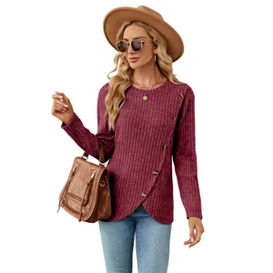 Elegant women's long sleeve round neck shirt with ribbed texture and tulip hem design.