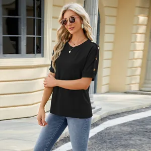 Stylish women's black crew neck T-shirt with button sleeve details and raglan cut.