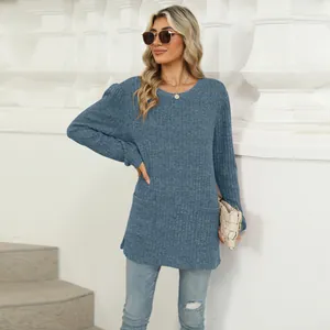 Close-up of blue ribbed knit top with puff sleeves and pockets for a casual look.