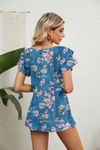Back view of blue floral T-shirt with layered ruffle sleeves and a loose summer fit
