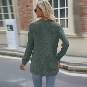 Back view of a loose casual long-sleeved t-shirt with puff sleeves and ribbed texture.