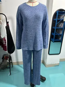 Close-up of blue ribbed knit two-piece lounge set showing fabric texture and fit on mannequin