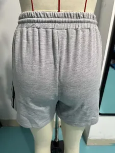 Detailed back view of grey casual athletic shorts with elastic waistband and stripes