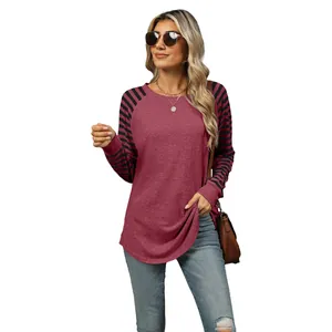 Casual women's long sleeve T-shirt featuring burgundy body and striped raglan sleeves